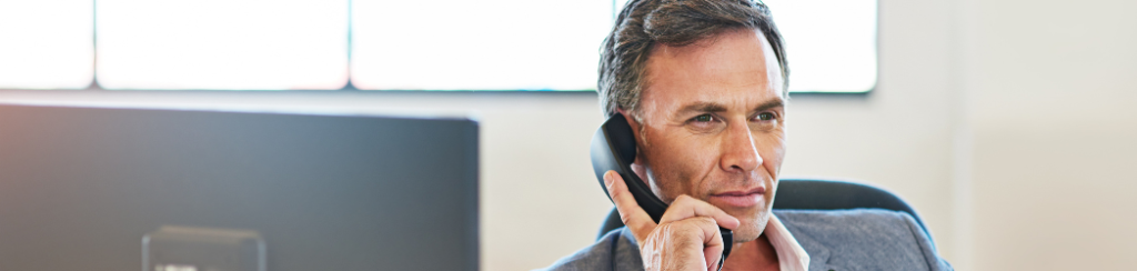 Man prioritizing customer communication through telephone